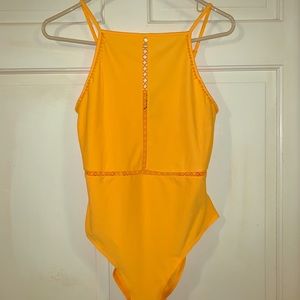 Bright yellow body suit